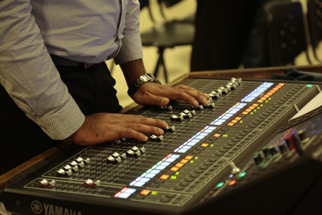 Sound engineer working at an audio mixing console